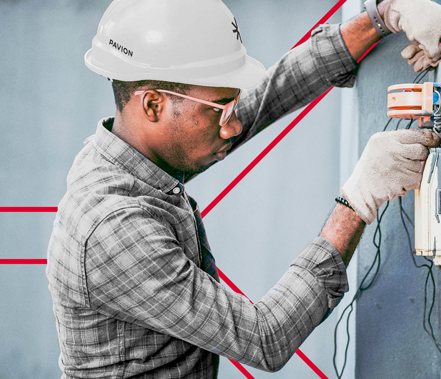 Man with hardhat working on an electrical panel - Pavion Fire Safety, Integration, and Security