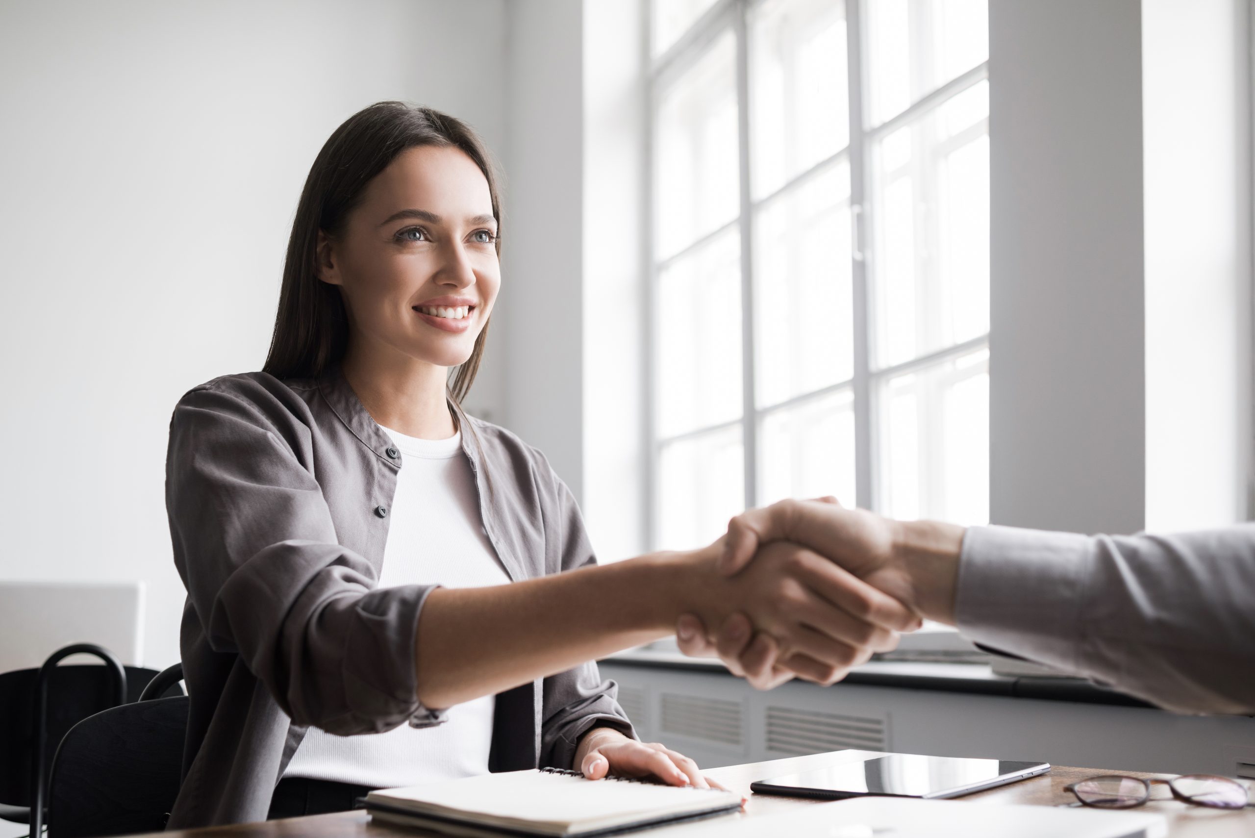 Young,Business,People,Shaking,Hands,In,The,Office.,Handshake,,Finishing